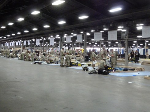 Teams organize their tools and materials, and prep their stations before the build begins.