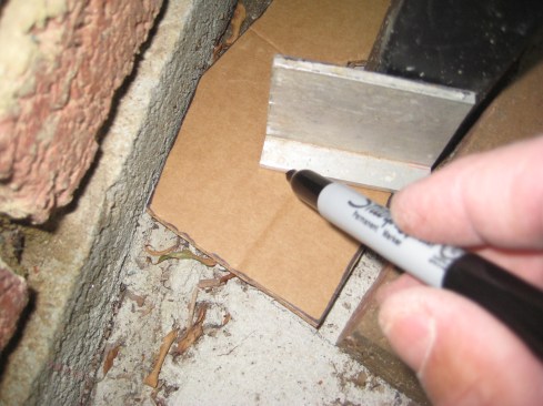 Using a small piece of aluminum angle against each of the flat surfaces of the post, the authortransfers the exact shape of the post to the template. 