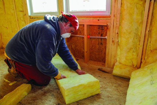 For stud bays below windows, cut the batts to length all at the same time.
