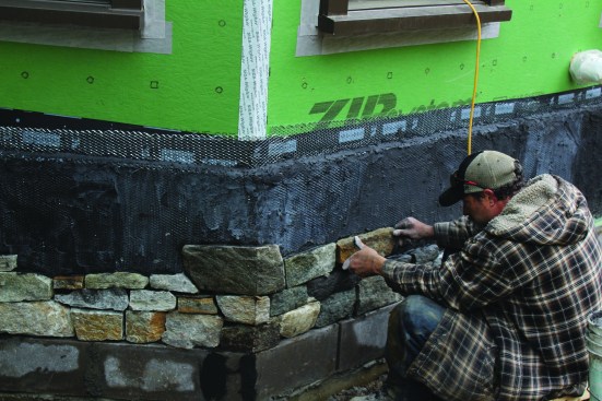 To make the 45-degree corners, the crew cuts 22.5-degree miters from the same stones, again working from the corner outward during installation.