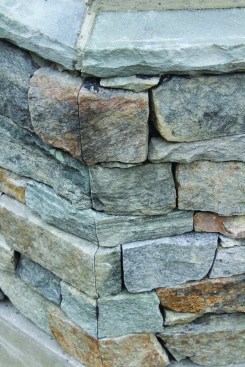 Cutting the miters from the same stone creates a sharp line with the grain of the stone continuing through the miter.