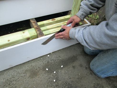When all the plugs have been tapped in, a Japanese saw is used to saw them flush. Everything will be sanded before being painted.