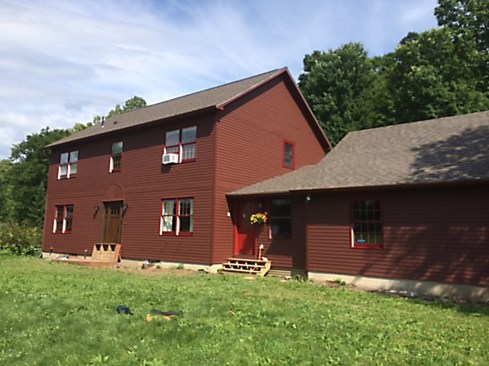A surface restoration like this costs about twice as much as a straight-up exterior repaint, but it's still significantly less than a siding replacement. It was the appropriate option, because despite the failed coating, the cedar siding underneath still had a lot of life left in it. The finish system we installed will last for many years, although we expect by the third year it will need some touch-up&nbsp;in high exposure areas.&nbsp;