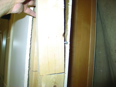 To remove the framing without damaging the drywall on the other side, I first cut each 2-by into small pieces.