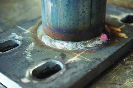 Setting the column in a vertical position provides a more comfortable position for the fabricator to weld. The finished weld should have a consistent width, shape, and pattern along its entire length.