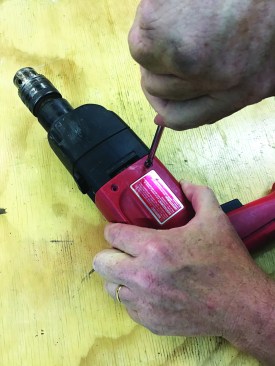 Then he screws the handle back together ...