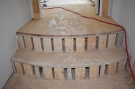 The framer roughed in the curve for the steps using 2-bys on end for the risers.