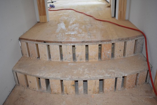The framer roughed in the curve for the steps using 2-bys on end for the risers.