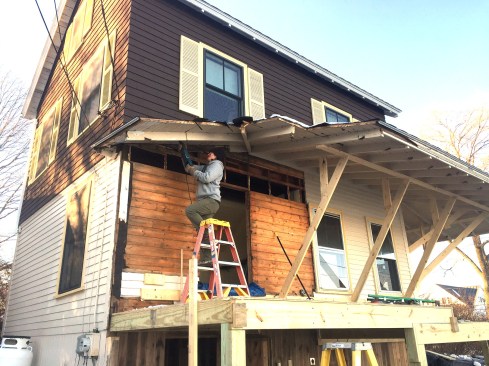 The crew temporarily supported the existing porch roof, while completely reconstructing the lower supporting structure and deck.