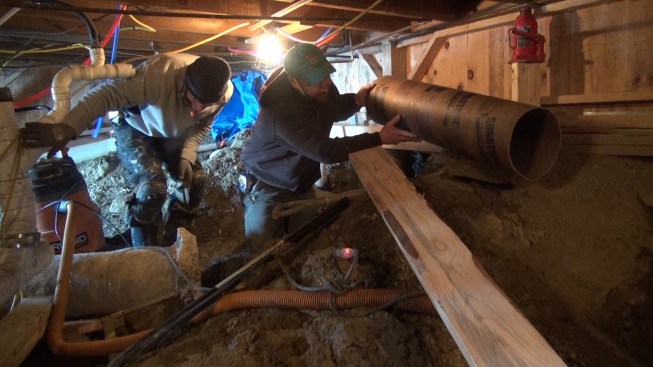 Shane brings in a new Sonotube for the replacement pier.