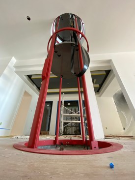 The shaftway frame is installed and secured to the basement, first-floor framing and ceiling.