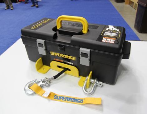 Superwinch’s Winch2go is a portable winch that can be powered by a 12-volt battery or battery pack. Able to pull up to 4,000 pounds, it’s designed for use in confined or hard-to-reach places. The motor is attached to a 1/4-inch steel base plate and housed within a plastic toolbox that contains everything needed for use with the winch: d-rings, a shackle, fabric straps, a remote control, and battery cables. Winch2go includes 50’ of wire cable or synthetic rope and sells for about $280. 
Click here for video.