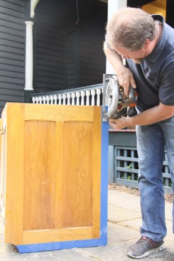 For longer straight runs where the line won’t be shown (this one will be covered by wainscot), he uses a circular saw outfitted with a finish blade. When this line will be visible, he uses a power plane. On high-end cabinets, he almost exclusively uses hand tools, and even scrapers. Reading the grain of the wood is important. When grain changes direction along the length of one board, as it can in many hardwoods, power planers and even hand planes can blow out the grain in an instant, so a scraper is often necessary. The process is more time consuming, but the result is what’s most important. The author typically knows the level of cabinet when he bids the job, so he’s sure to account for the extra time these types of details will take.