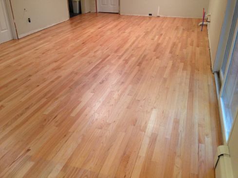 To satisfy his client's wishes for a hardwood floor in their new kitchen, contractor Manny Silva blended new oak strip flooring with the existing flooring in the adjacent room. The new floor creates an even base for the cabinets and an invisible transition between the two rooms.