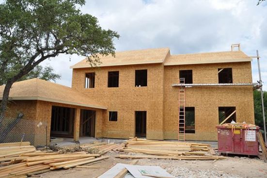All OSB Sheating with a bottom 2' course of Pressure Treated Plywood