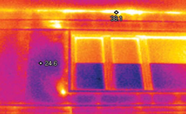 Note also the air leaks at the window heads; the cooler rectangles at the bases of the windows are exterior screens.