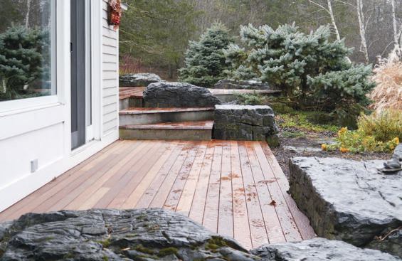 The 600-square-foot deck had three levels, and there were several rock outcroppings to work around.