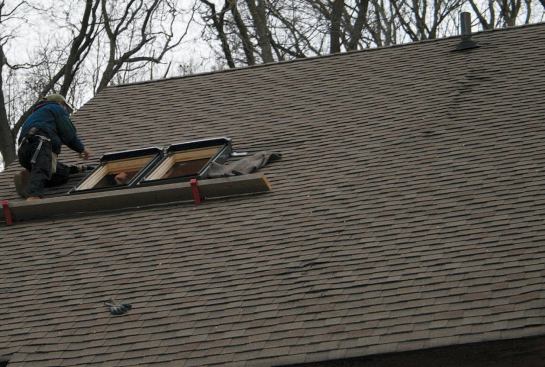 A vertical ripple in the shingles was caused by a slight displacement in the roof panels edges.
