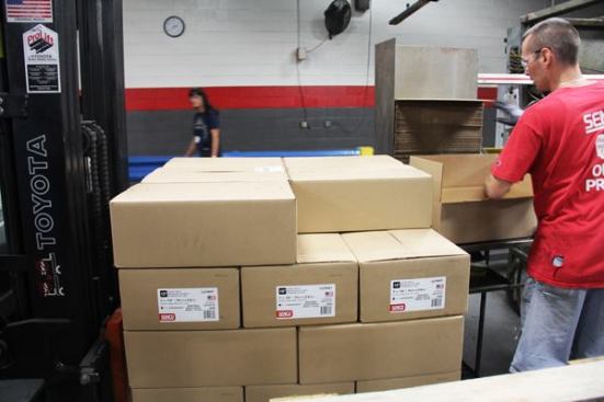 This man is hand-boxing coils of pallet nails as they come out of the machine. He runs a production cell that contains multiple nail making machines. In the old days wire would have been cut, pointed, headed, ringed, and collated by multiple people in multiple locations inside the plant. Now, a single person can turn wire into a finished product that is boxed and ready to ship.