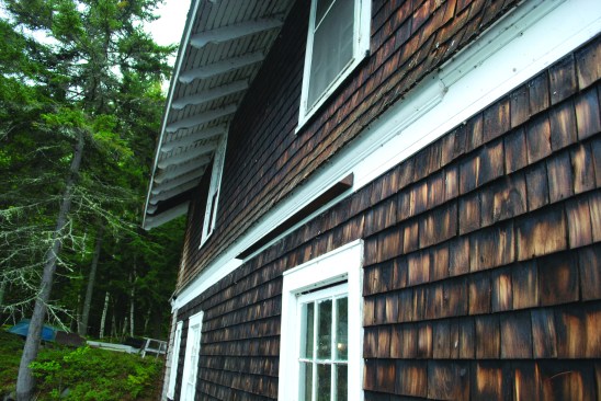 A steel angle was installed on the outside of the east wall to spread the load from the turnbuckle assembly over the top plates and several second-floor joists.