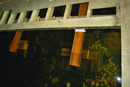 The existing 6x6 support beam on the west side of the boathouse developed a sag as the needle beam was raised, so the crew we added smaller, less elaborate supports at two other places along that side.