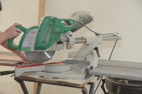The second side casing is cut to length with a 45-degree miter cut.