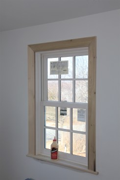When the corners are glued and tacked in place, the carpenter goes back and nails the inside edge of the casing to the jamb and the outside edge to the framing of the rough opening. 