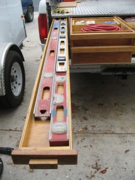 The upper box clears the wheel well and is as long as the bed.