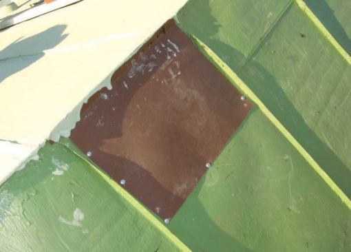Painted sheet aluminum was used to patch holes where vents had been removed.