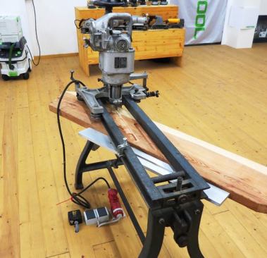 This very cool machine cuts dados for treads in stair stringers. It reminds me in some ways of the router devices used to cut mortises for mortise locks; you turn cranks and knobs this way and that—which advances and lowers the bit. 
Click here to see it in action.