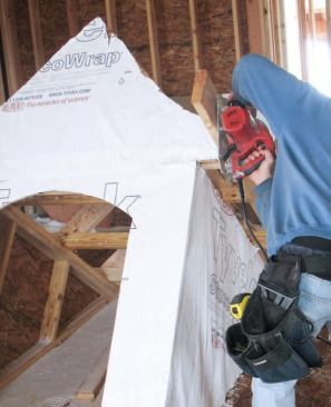 Subfascia: For speed we ran the subfascia long, then trimmed it at the gable; we held up its angled end on a scrap of 3/4-inch sheathing, so the roofer would be able to slide his shingles into the gap.