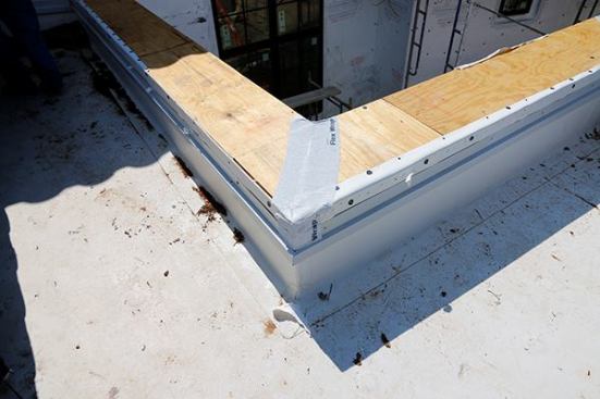 Tyvek Flexwrap on corners first. THEN sheet membrane
