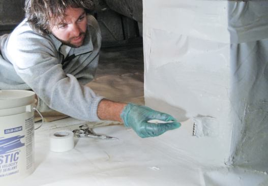 To prevent moisture from the high water table from welling up through the liner, I applied fiberglass tape and mastic to the seams.