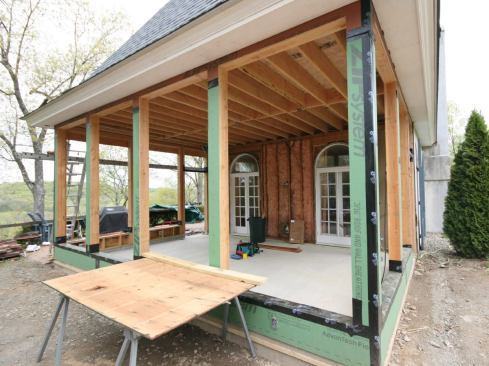 To complete the window openings, we built short, 17-inch-high walls between posts, then sheathed them and the posts with Zip System panels. Next, we waterproofed the walls by taping both the sheathing seams and the rough sills with Zip tape.