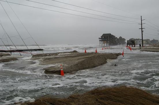 Wind and surf pound the highway and utility lines at N.C. 12’s entry to Rodanthe in this November 19 NCDOT photo. “Wow, this is disheartening even though we're not due there 'til next spring!” comments a prospective vacationer.