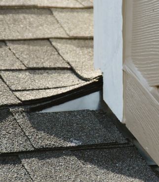 A partial diverter extending the sloped surface several inches beyond the corner