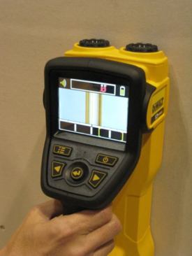 In addition to wood, the scanner can sense ferrous and non-ferrous metal, plastic pipe, and electrical wires. The screen is displaying a copper pipe, which means there is non-ferrous metal on the other side of the drywall.