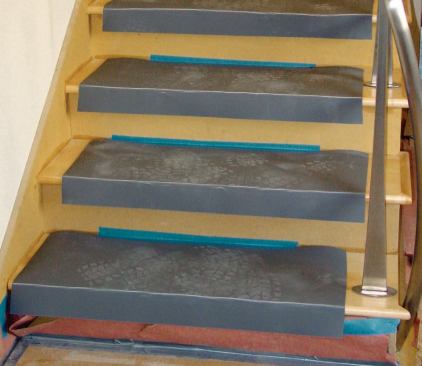 The tread and nosing of hardwood stairs are covered with Pro Tecta Top. The unprotected MDF risers will be painted later.