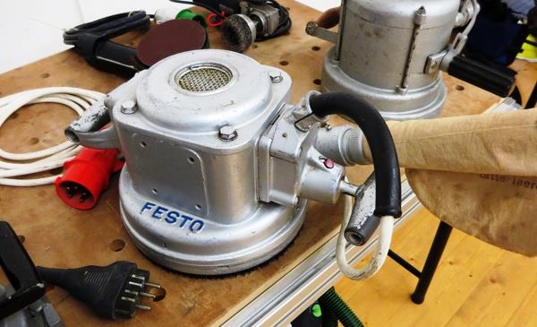 I have no idea what this tool is; it looks like some kind of rotary sander or grinder. Am guessing it’s a sander because you would not put a cloth collection bag on a tool that produces sparks.