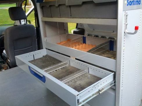 Above the lift-up door is a shallow drawer.