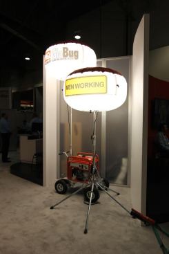 Here are two of the smaller 
GloBug balloon lights from Multiquip. An integral fan keeps the fabric diffuser inflated and away from the bulb in metal halide models. There are also some LED models. GloBugs can be used for road construction, mining, disaster relief, and wherever highly portable lights are required. These things are incredibly bright; the Multiquip booth was in a part of the convention center that is normally dim. Not this time.