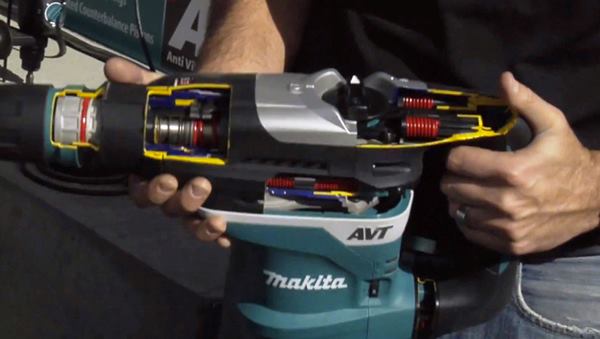 A Makita product manager uses a cut-away of the company's 
HR4013C to show how the vibration dampening system works.