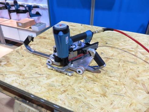This insane gizmo was being demonstrated at the BeA booth. It’s called the Skater, and it’s an automatic stapler used to fasten subfloor in RVs and manufactured housing. Roll it along the material being fastened and it drives staples at the spacing you choose (a wheel gauges the distance rolled and fires at the correct spacing). I saw the thing in action: It was the nail gun equivalent of a machine gun. It drove staples that fast. 
Click here for the manufacturer’s video of how the thing works. Don’t even think about buying one of these unless you have $5,000+ to spend.