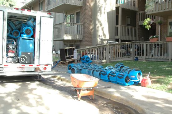 A look inside a disaster clean up company truck: full of pumps, mobile dehumidifiers, and air movers.