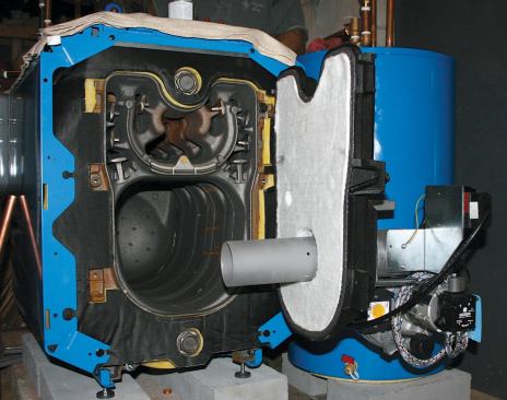 A perforated ceramic tube inside the cast-iron combustion chamber allows gases to recirculate past the burner before exiting the flue, resulting in more complete combustion — and bumping up the boiler's efficiency rating.