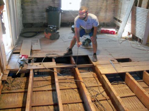 The nails holding the old subfloor didn't offer much resistance to my long pry bars, and once I got an end separated from the joist, the rest of the board popped out quite easily.