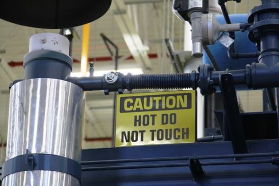 This sign is on a natural gas furnace that regularly goes to 1,600 degrees. I don’t imagine you’d have to touch it more than once to learn it would be a bad idea to touch it again.