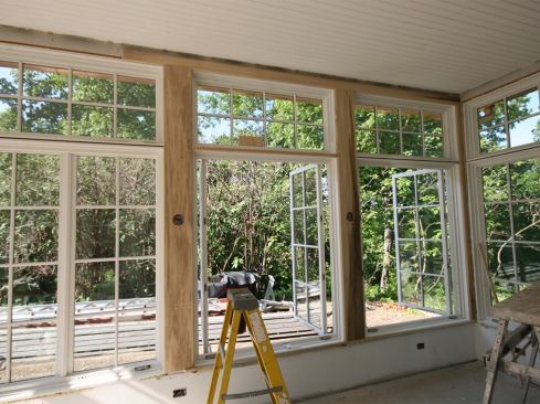 We installed 1x6 finger-jointed pine bead board on the sunroom ceiling, and used poplar for window and door trim. To match the profile of the windows, we milled a decorative bead on the casings. This complicated the window trim at the intersection of the mulled jambs with the trim at the post…