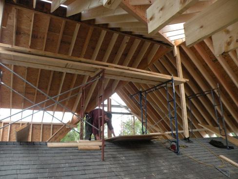 Leaving the existing roof in place while building the new roof simplified the problem of staging the job, and made it easy to construct a stable working platform for the framers. The existing roof also provides a convenient walking and working surface, notes DiGiammo.