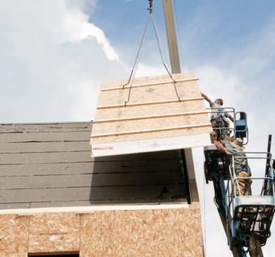 Preinstalled 2-by walk boards reinforced the connection between the lifting hooks and the OSB skins of the roof panels.